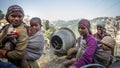 Group of young working mums carry infant on their back smile while doing work routine at construction site at Shimla district, Him Royalty Free Stock Photo