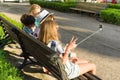 Group of youth is having fun together outdoors in urban background. Summer holidays, education, teenage concept. Royalty Free Stock Photo