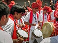 Group of youths beating traditional dhol & tasha collectively during festival