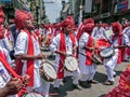 Group of youths beating traditional tasha collectively in Ganapati procession