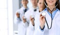 Group of doctors holding stethoscope head close-up. Physicians ready to examine and help patient. Medical help Royalty Free Stock Photo