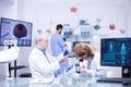 Groupe of researchers in pharmacology in a hospital laboratory Royalty Free Stock Photo