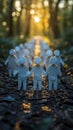 Grouped Paper Figures Under a Forest Light Royalty Free Stock Photo