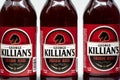Groupin of Three George Killian`s Irish Red Beer Bottles and Trademark Logo