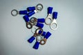 Grouping of various sizes of blue wire connectors Royalty Free Stock Photo