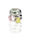 Grouping of three colored gemstone diamond rings stacked