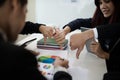 Groups of Asian businessmen show dislike or unlike thumbs down h