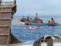 Boat with fishermen and conveyor belt