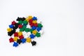 Groups of colorful meeples isolated on white background. Blue, red, black, green and yellow. Small figures of man. Board games