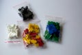 Groups of colorful meeples of two teams. Colors of ukrainian flag - blue and yellow. Small figures of man