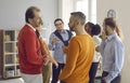 Groups of different people standing randomly and talking on business meeting Royalty Free Stock Photo