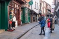 Groups of female oriental tourists posing for photographs in the historic Shambles street in York