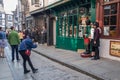 Groups of female oriental tourists posing for photographs in the historic Shambles street in York