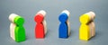 Groups of multicolored wooden people. The concept of market segmentation. Customer relationship management. Target audience,