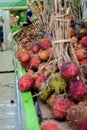 Groups of rambutan fruits displayed in market box