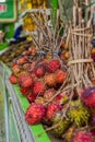 Groups of rambutan fruits displayed in market box