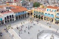 Groups of tourists visit the Old Square in Havana