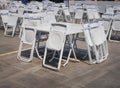 Groups of White Collapsible Chairs and Tables for the Event Royalty Free Stock Photo