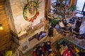 Groups of young people chatting at a vintage cafe talking and using smartphone during Christmas holiday top view.