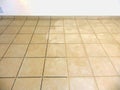 Grouting floor tiles Royalty Free Stock Photo