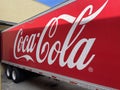 Coke delivery truck at a retail store dock side logo