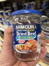 grocery store hand holding Armour Dried beef