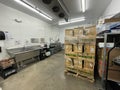 Grocery store Whole cases of corn shipment in a backroom Royalty Free Stock Photo