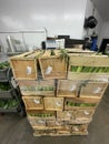 Grocery store Whole cases of corn shipment wide view Royalty Free Stock Photo