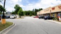 POV walking retail strip mall parked cars