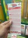 Retail grocery store Georgia lottery hand holding play slip
