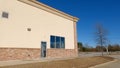 Retail strip mall clear blue sky side building