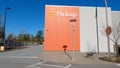 Walmart grocery store exterior clear blue sky orange store pickup sign