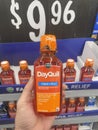 Walmart grocery store hand holdiing DayQuil