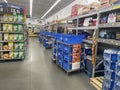 Walmart grocery store online shopper carts and blue totas lined up