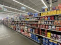 Walmart retail store interior lookign down coffee aisle