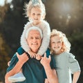 They grow up in the most delightful way. a senior man spending time with his grandchildren outside. Royalty Free Stock Photo