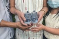 A growing family of four. The pregnant wife, husband and eldest daughter show cute baby shoes. Anonymous shot