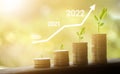 Growing growth year 2019 to 2022. Business graph with arrow up. Growing money coins stack. Saving money investment Royalty Free Stock Photo