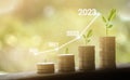 Growing growth year 2020 to 2023. Business graph with arrow up. Growing money coins stack. Saving money investment Royalty Free Stock Photo