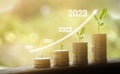 Growing growth year 2020 to 2023. Business graph with arrow up. Growing money coins stack. Saving money investment Royalty Free Stock Photo