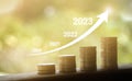 Growing growth year 2020 to 2023. Business graph with arrow up. Growing money coins stack. Saving money investment Royalty Free Stock Photo