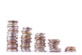Growing money graph on a row of coin and pile of bath coins stack on white background finance business isolated