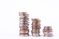 Growing money graph on a three row of coin and pile of bath coins stack on white background finance business isolated