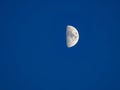 the growing moon in the first quarter with craters Royalty Free Stock Photo