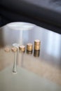 Growing one euro coin columns on glass table Royalty Free Stock Photo