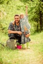 Growing plants. Take care of plants. Boy and father in nature with watering can. Spring garden. Dad teaching little son Royalty Free Stock Photo