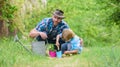 Growing plants. Take care of plants. Boy and father in nature with watering can. Gardening tools. Planting flowers. Dad Royalty Free Stock Photo