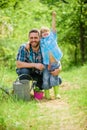 Growing plants. Take care of plants. Boy and father in nature with watering can. Spring garden. Dad teaching little son Royalty Free Stock Photo