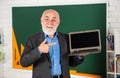 Growing role distance learning. Senior intelligent man teacher use laptop. School education concept. Useful knowledge Royalty Free Stock Photo