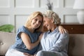Grown up granddaughter spend pleasant time with old grandmother